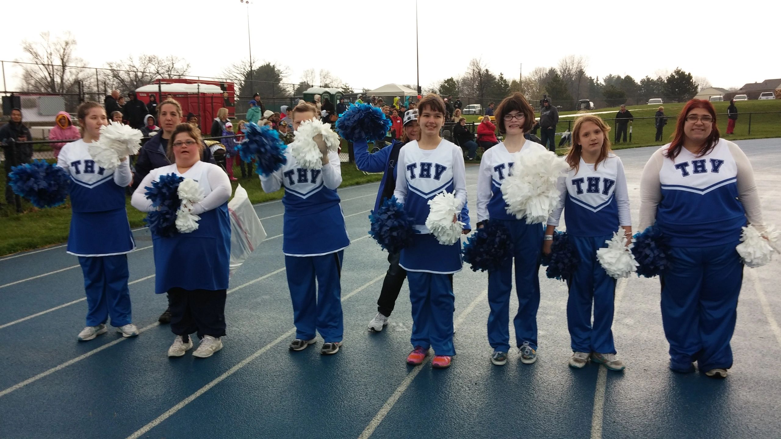 THV cheerleaders with pom-poms at community event